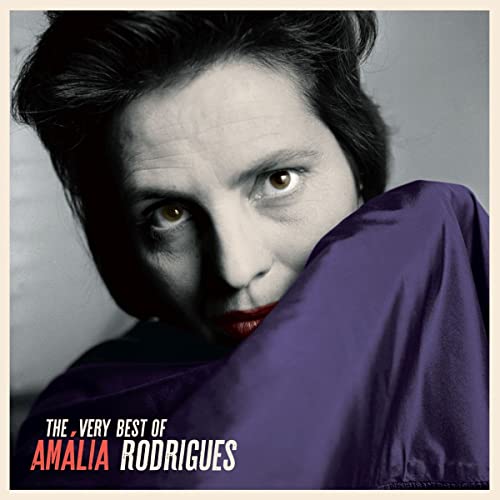 Black and white portrait of Amalia Rodrigues with a purple shawl and red lips.