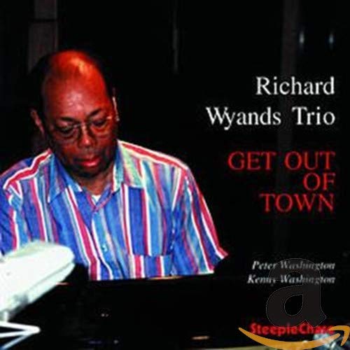 Richard Wyands at a piano, album cover for "Get Out Of Town" CD.