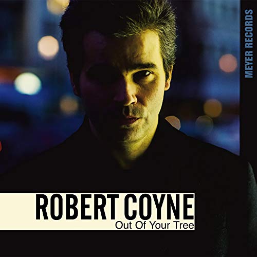 Robert Coyne album cover, close-up portrait with blurred city lights.