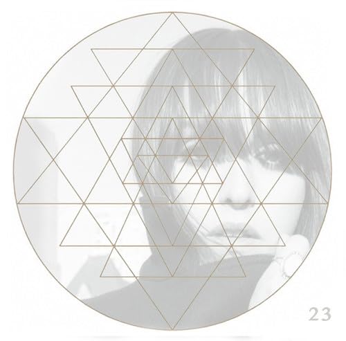 Circular album cover with a woman’s face overlaid by a geometric pattern.