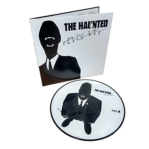 Vinyl record and cover art for The Hauntedās āRevolver,ā featuring a masked figure.