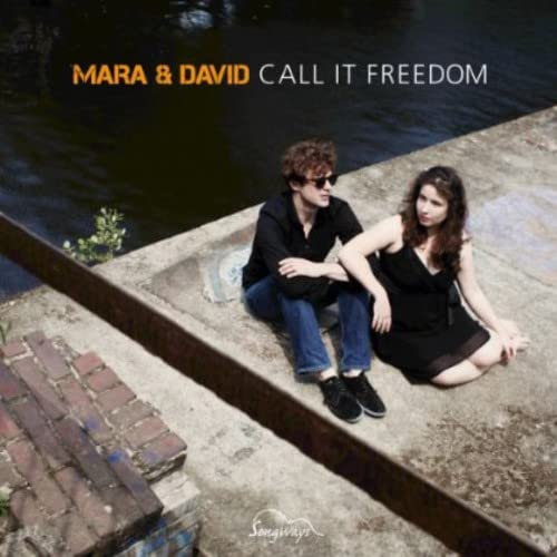 CD cover: Mara & David sitting on concrete near water.