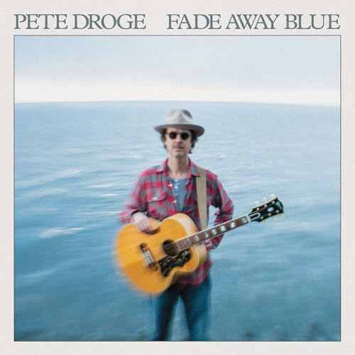 CD cover: man with guitar by water, blue and white tones.