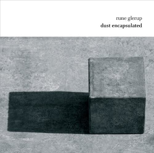 CD cover with two gray stone blocks and stark shadows.