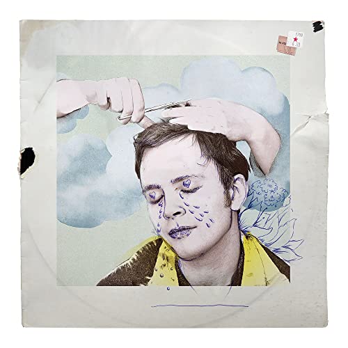 Vinyl record cover with a portrait of a man and blue floral details.