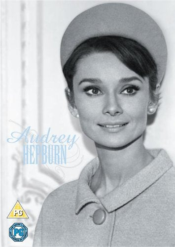Black and white portrait of Audrey Hepburn wearing a hat and coat.