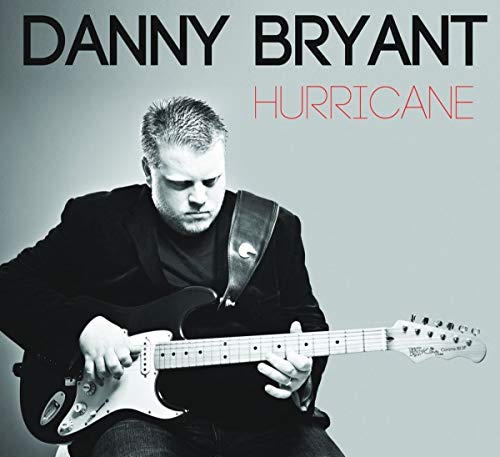 Danny Bryant portrait holding a white electric guitar, album cover.