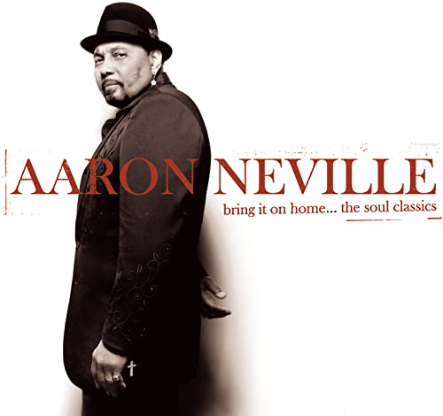 Aaron Neville in a hat and suit, album cover for "Bring It On Home.