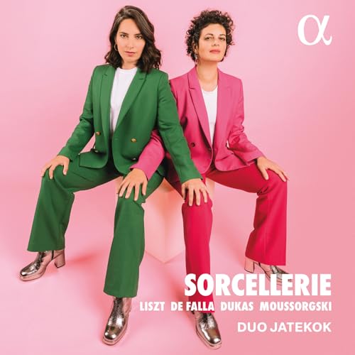 CD cover featuring two women in suits, seated on a white cube.