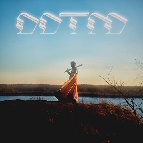 Album cover: person with saxophone silhouetted against a sunset landscape.