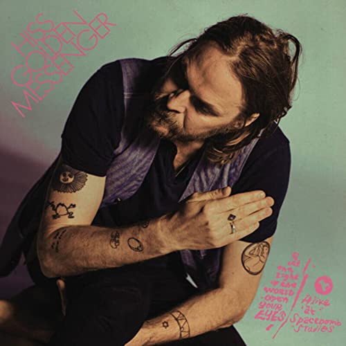 Album cover featuring a man with tattoos and pink text.