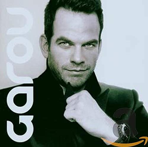 Black and white portrait of a man with short dark hair, CD cover.