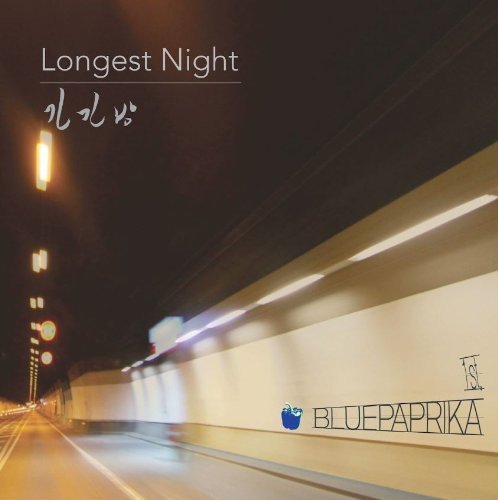 CD cover for "Longest Night" with a blurry tunnel and lights.