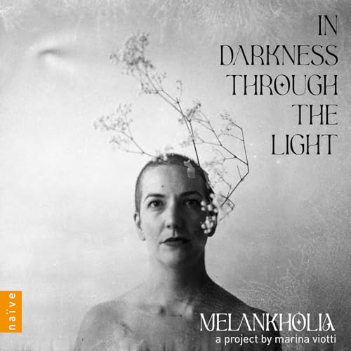 Woman’s face with flowers emerging from her head, grayscale album cover.