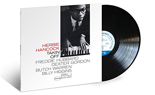 Herbie Hancock's "Takin' Off" vinyl record with a portrait of the artist.
