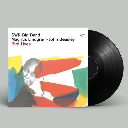Vinyl record with album cover featuring a portrait and abstract shapes.
