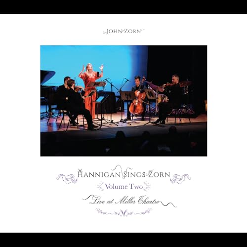 CD cover: Singer and musicians performing on a dimly lit stage.