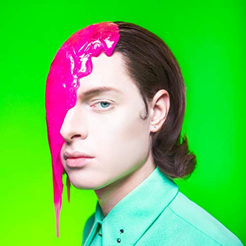 Man with pink liquid dripping down half of his face.