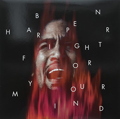 Album cover: distorted face with red flames and scattered letters.