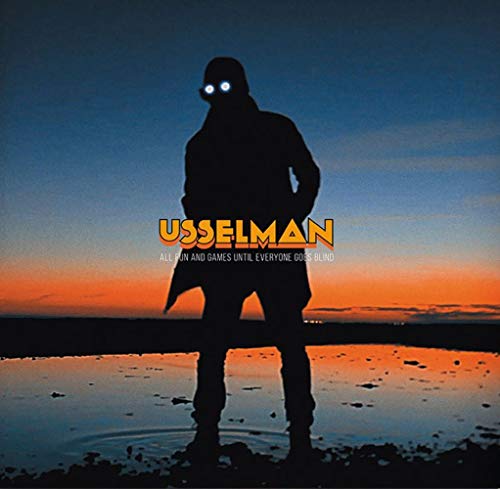 Silhouetted figure with glowing eyes against an orange and blue sky.