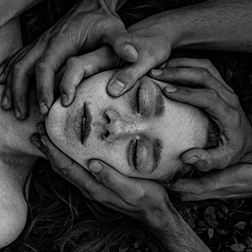 Black and white album cover featuring a face held by multiple hands.