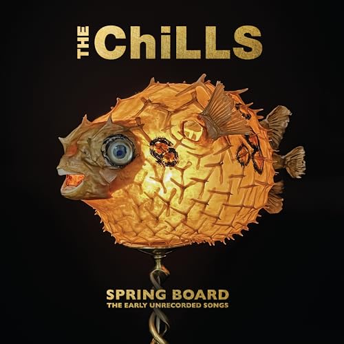 Album cover for The Chills’ “Spring Board” featuring a glowing pufferfish.