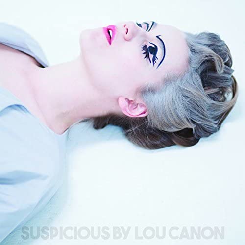 CD cover: woman with dramatic makeup lying down, grey hair.