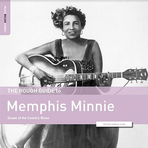 Black and white portrait of Memphis Minnie with her guitar.