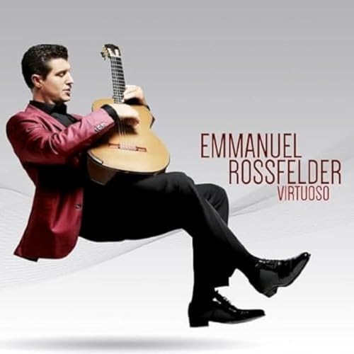 Man in suit playing acoustic guitar on CD cover.