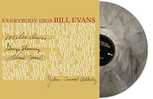Red marbled vinyl record with text on sleeve and label visible.