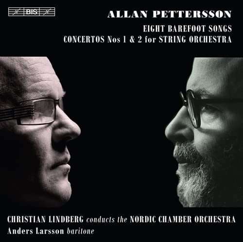 CD cover: Two men in glasses facing each other, dark background.