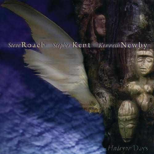 CD cover with a feather, carved faces, and dark, textured background.