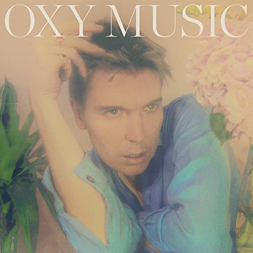 Album cover for “Oxy Music” featuring a man surrounded by flowers.
