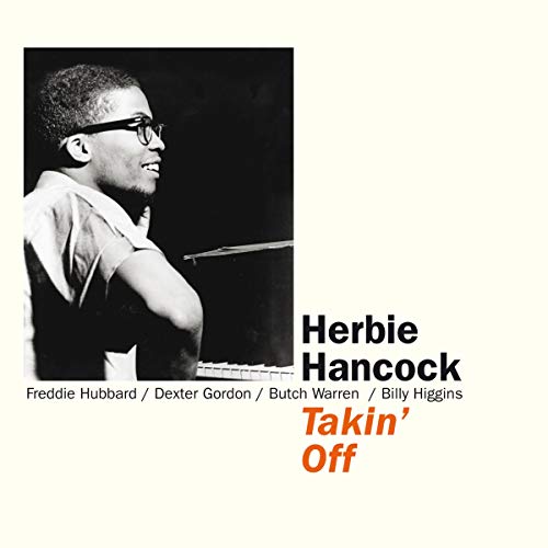 Black and white portrait of Herbie Hancock at a piano on album cover art.