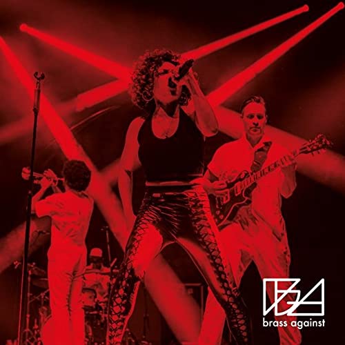 Brass Against band performing live on stage, red and black lighting.
