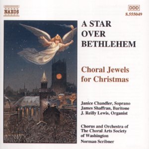 CD cover: angel above a town with church steeple, Christmas music.