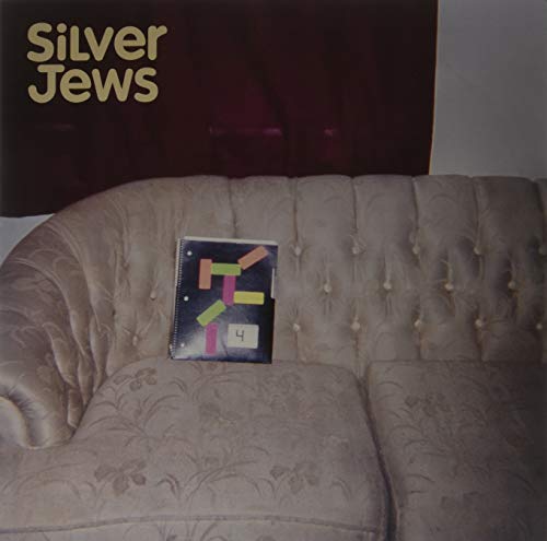 Silver Jews album cover: a notebook on a patterned, beige couch.