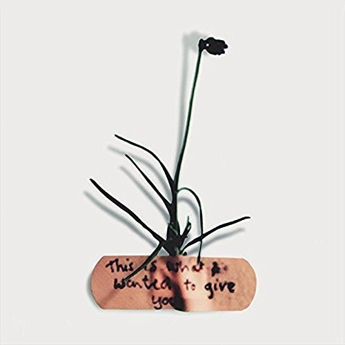 CD cover: a dark flower growing from a bandage with text.