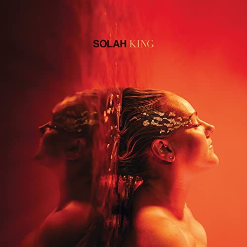 Album cover for Solah’s “King” featuring a person with golden adornments.