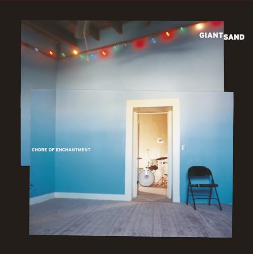 Album cover: a light blue room with a drum kit and chair.
