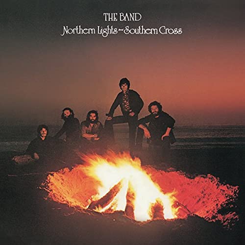 The Band album cover: five men around a bright campfire on a beach.
