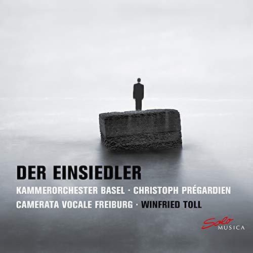 CD cover: lone figure on a stone block in a misty landscape.