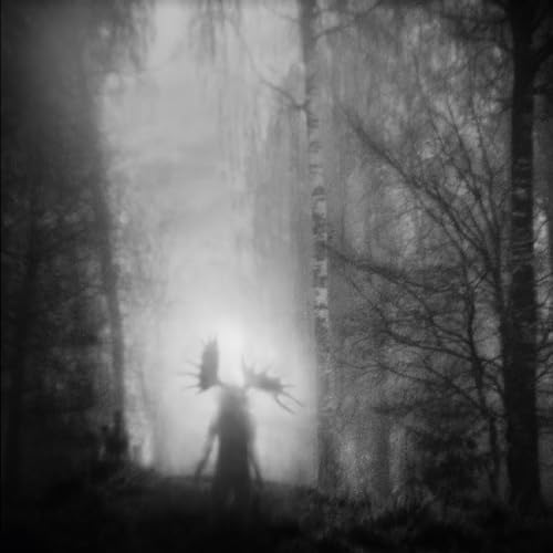 Black and white image of a figure with antlers in a forest.