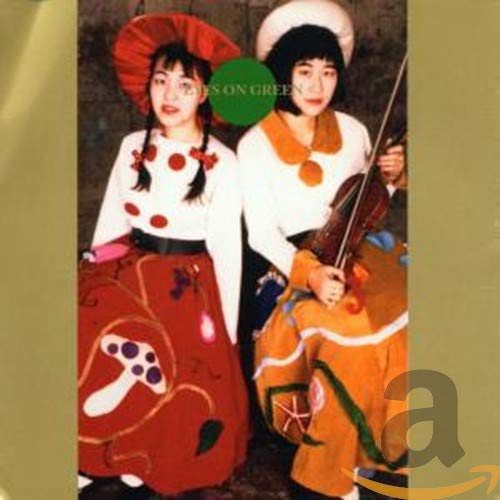 CD cover featuring two people in colorful, patterned outfits.
