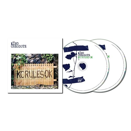 King Creosote CD case and two discs with a garden gate image.