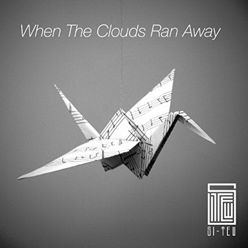 CD cover: origami bird made of sheet music against a gray background.