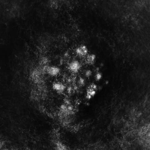 Dark, abstract image with a central cluster of bright, blurred shapes.