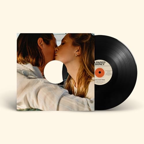 Vinyl record with album cover depicting two people kissing.