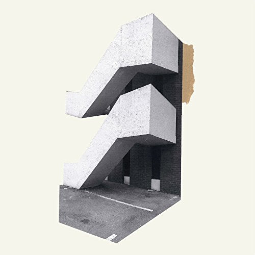 Concrete staircase against a brick wall, album cover art.