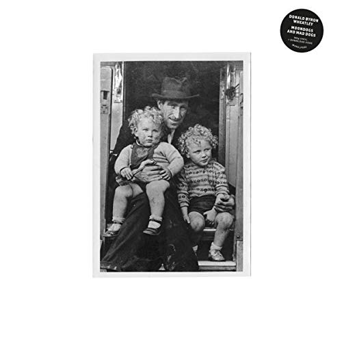 Black and white photo of a man with two young children.
